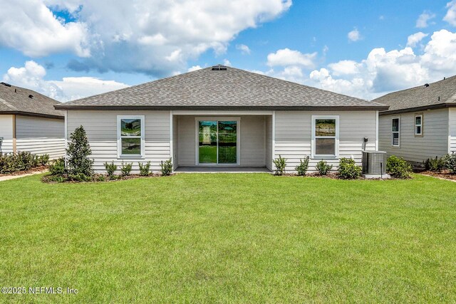 37119 Whippoorwill Ct, Hilliard, FL 32046 - rear view of property with a lawn and roof with shingles