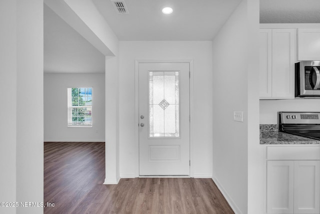 37119 Whippoorwill Ct, Hilliard, FL 32046 - entrance foyer with wood finished floors and baseboards