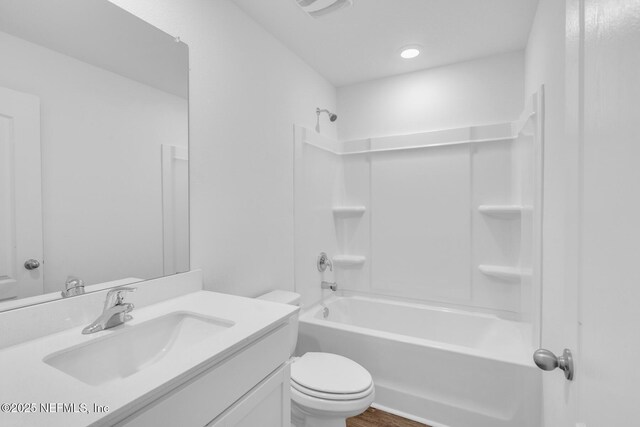 37119 Whippoorwill Ct, Hilliard, FL 32046 - bathroom with vanity, washtub / shower combination, and wood finished floors