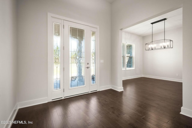 36295 Pitch Ln, Hilliard, FL 32046 - foyer with a chandelier and dark wood finished floors