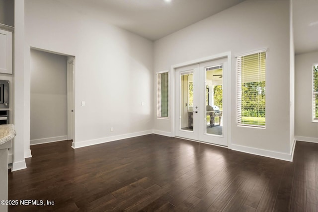 36295 Pitch Ln, Hilliard, FL 32046 - unfurnished room featuring french doors and dark wood-style flooring