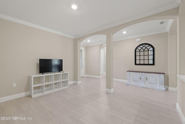 37 Tobago Ln, Saint Augustine, FL 32092 - unfurnished living room with arched walkways, ornamental molding, and recessed lighting