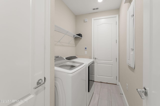 37 Tobago Ln, Saint Augustine, FL 32092 - laundry room featuring washing machine and clothes dryer and baseboards