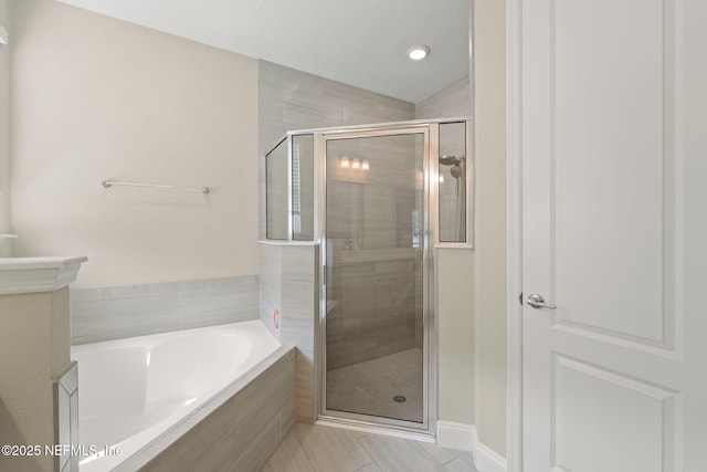 37 Tobago Ln, Saint Augustine, FL 32092 - bathroom with a garden tub, a stall shower, tile patterned flooring, and recessed lighting