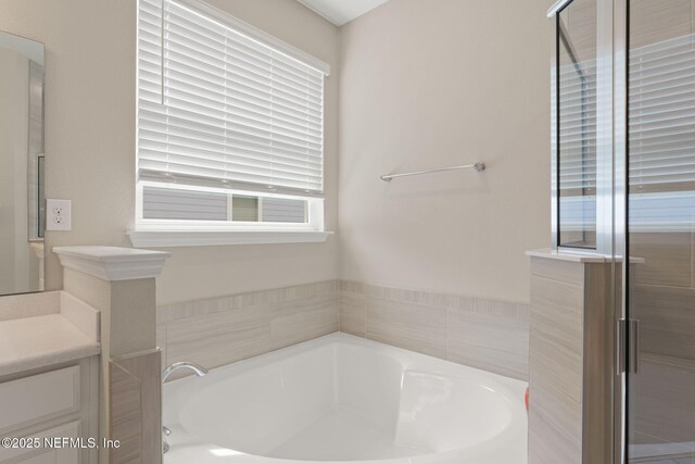 37 Tobago Ln, Saint Augustine, FL 32092 - bathroom featuring a garden tub and vanity