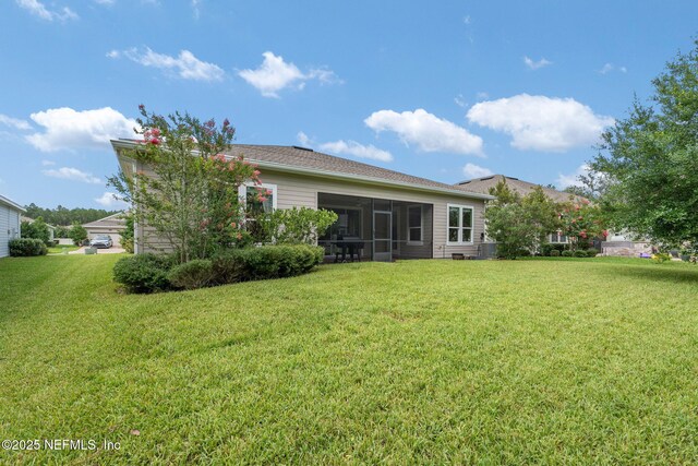 37 Tobago Ln, Saint Augustine, FL 32092 - back of property with a yard and a sunroom