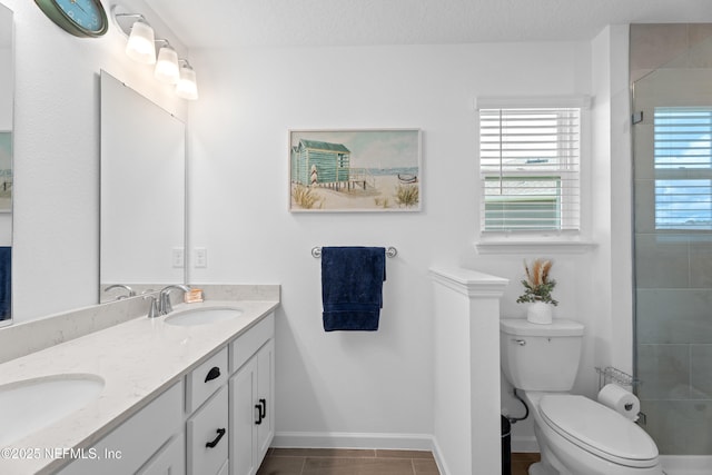 67 Carmella Ct, Saint Augustine, FL 32092 - bathroom featuring plenty of natural light, double vanity, a tile shower, and tile patterned floors