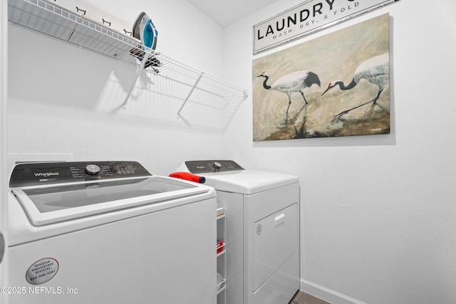 67 Carmella Ct, Saint Augustine, FL 32092 - laundry area with washer and clothes dryer and baseboards