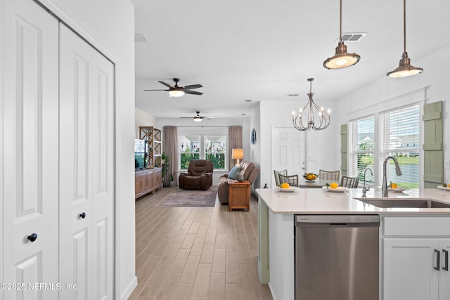 67 Carmella Ct, Saint Augustine, FL 32092 - kitchen featuring dishwasher, light countertops, hanging light fixtures, a ceiling fan, and white cabinets