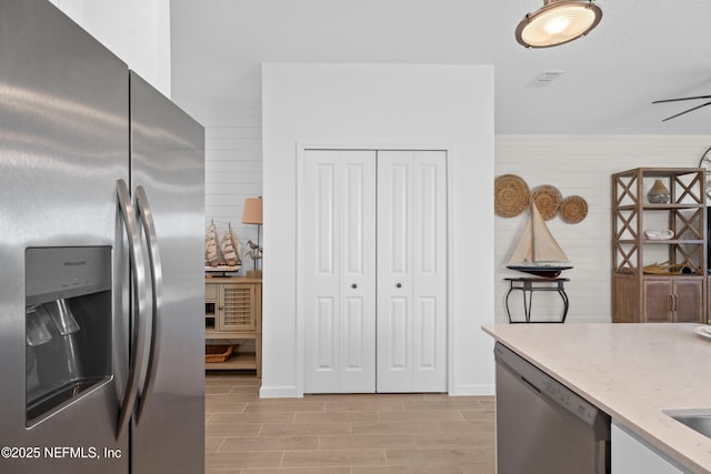 67 Carmella Ct, Saint Augustine, FL 32092 - kitchen featuring stainless steel appliances, light stone counters, and light wood-type flooring