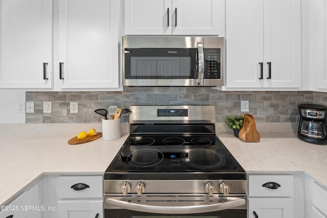 67 Carmella Ct, Saint Augustine, FL 32092 - kitchen featuring stainless steel appliances, white cabinetry, and backsplash