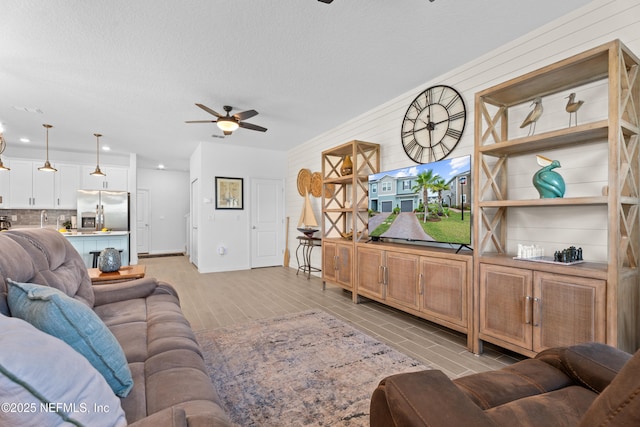 67 Carmella Ct, Saint Augustine, FL 32092 - living room featuring a ceiling fan, recessed lighting, and a textured ceiling