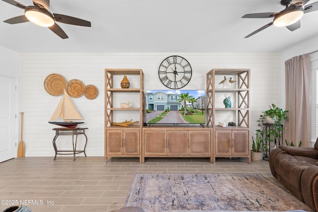 67 Carmella Ct, Saint Augustine, FL 32092 - living area featuring a ceiling fan and wooden walls