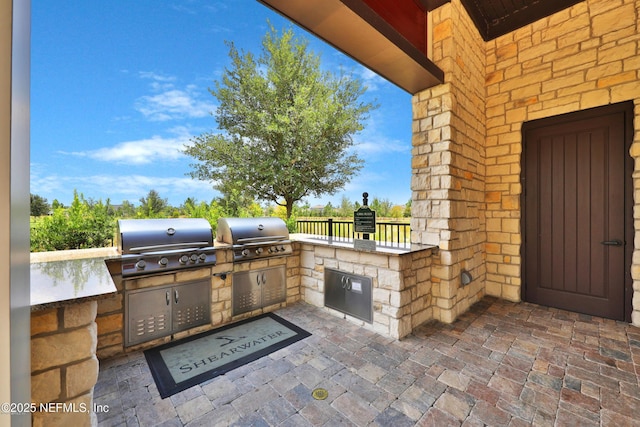 67 Carmella Ct, Saint Augustine, FL 32092 - view of patio / terrace featuring exterior kitchen