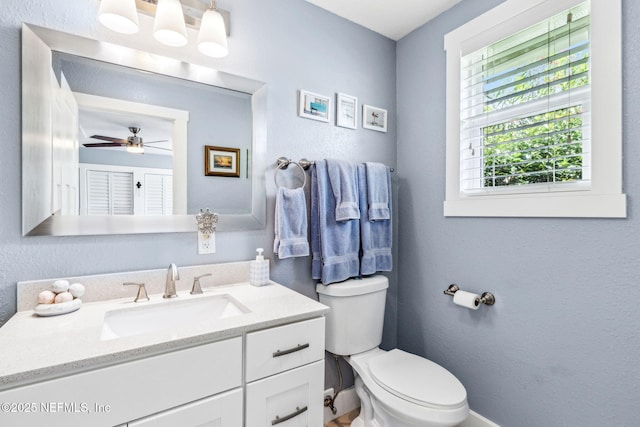111 S 4th St, Fernandina Beach, FL 32034 - half bath with vanity, a ceiling fan, and a textured wall