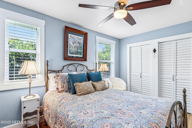 111 S 4th St, Fernandina Beach, FL 32034 - bedroom with two closets, wood finished floors, and ceiling fan