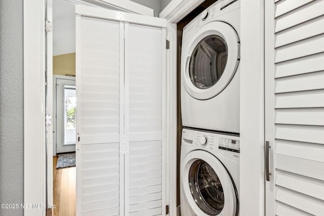 111 S 4th St, Fernandina Beach, FL 32034 - laundry room with stacked washer and clothes dryer and wood finished floors