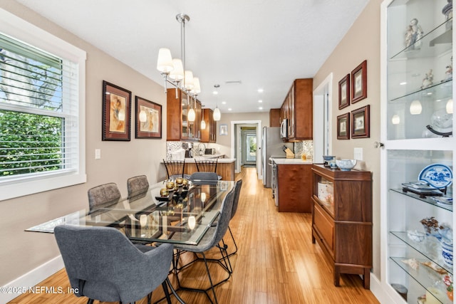 111 S 4th St, Fernandina Beach, FL 32034 - dining space with light wood finished floors and baseboards