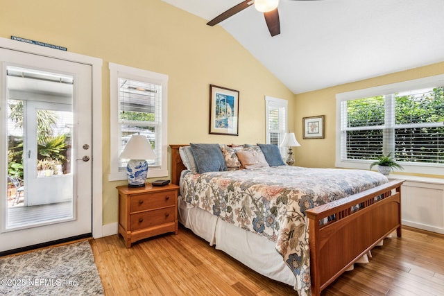 111 S 4th St, Fernandina Beach, FL 32034 - bedroom with vaulted ceiling, access to exterior, light wood-style floors, and a ceiling fan