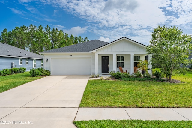 204 Bryson Dr, Fruit Cove, FL 32259 - ranch-style home featuring board and batten siding, a garage, concrete driveway, a front lawn, and covered porch