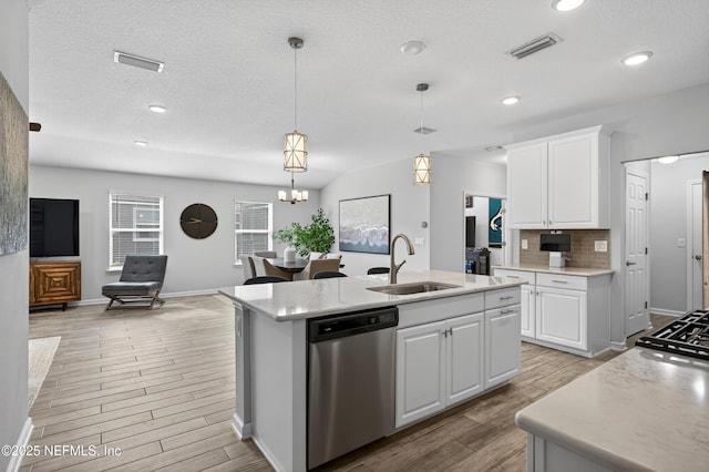 204 Bryson Dr, Fruit Cove, FL 32259 - kitchen with dishwasher, light wood-style floors, open floor plan, decorative backsplash, and recessed lighting