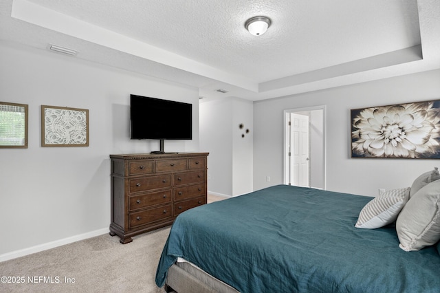 204 Bryson Dr, Fruit Cove, FL 32259 - bedroom with light carpet, a textured ceiling, and a tray ceiling