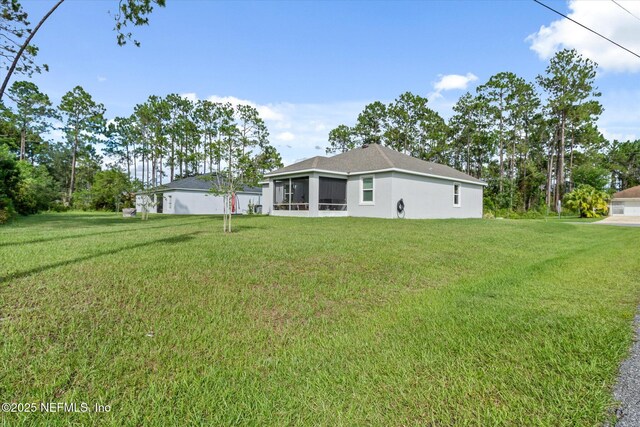 5 Bud Hollow Dr, Palm Coast, FL 32137 - view of grassy yard featuring a sunroom