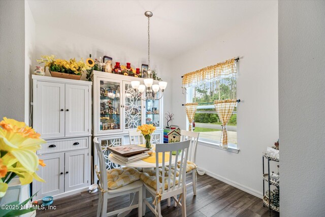 5 Bud Hollow Dr, Palm Coast, FL 32137 - dining space featuring dark wood-style floors and a chandelier