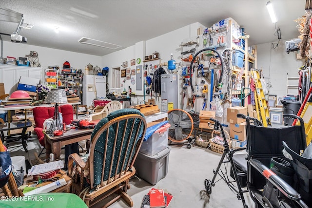5 Bud Hollow Dr, Palm Coast, FL 32137 - garage featuring white refrigerator with ice dispenser, water heater, a workshop area, and a garage door opener