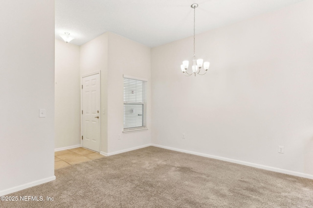 218 Larkin Pl Unit 110, Saint Johns, FL 32259 - empty room featuring light carpet, a chandelier, and light tile patterned floors