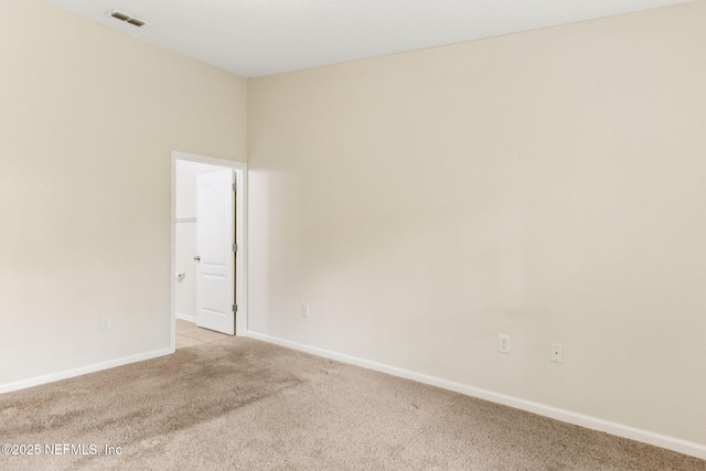 218 Larkin Pl Unit 110, Saint Johns, FL 32259 - spare room featuring light carpet and baseboards