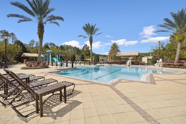 218 Larkin Pl Unit 110, Saint Johns, FL 32259 - community pool featuring a patio and a water play area