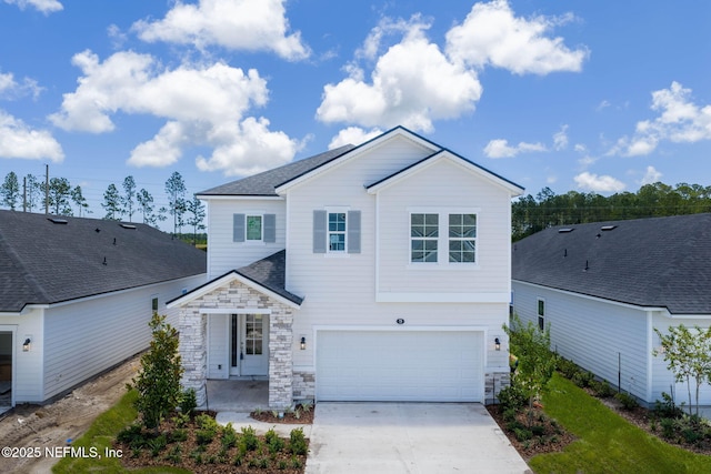 73 Ripple Rd, Saint Johns, FL 32095 - traditional home featuring a garage, stone siding, driveway, and roof with shingles