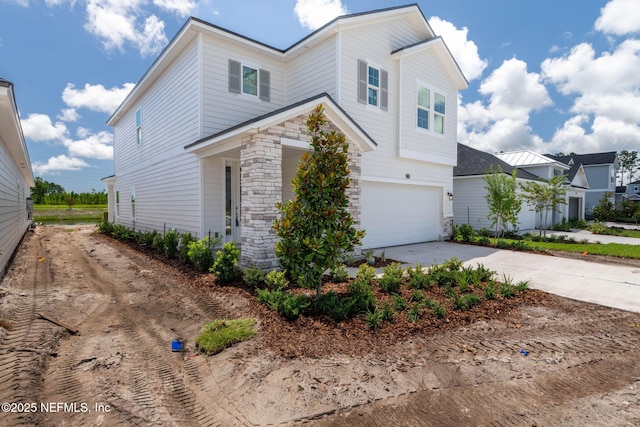 73 Ripple Rd, Saint Johns, FL 32095 - traditional home featuring concrete driveway, an attached garage, and stone siding