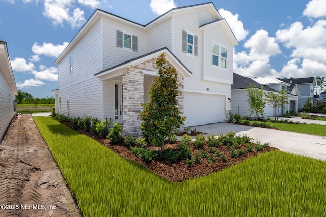 73 Ripple Rd, Saint Johns, FL 32095 - view of front of home with concrete driveway, an attached garage, and stone siding