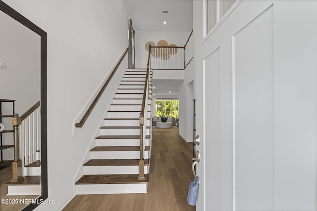 73 Ripple Rd, Saint Johns, FL 32095 - staircase with a high ceiling, wood finished floors, and recessed lighting