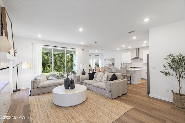 73 Ripple Rd, Saint Johns, FL 32095 - living area featuring light wood-style flooring and recessed lighting
