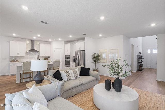 73 Ripple Rd, Saint Johns, FL 32095 - living area featuring light wood-style flooring and recessed lighting