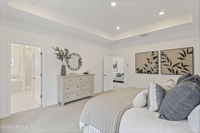 73 Ripple Rd, Saint Johns, FL 32095 - bedroom featuring recessed lighting, light colored carpet, connected bathroom, and a raised ceiling