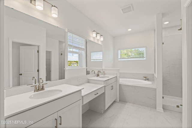 73 Ripple Rd, Saint Johns, FL 32095 - bathroom featuring marble look tile flooring, a garden tub, vanity, a marble finish shower, and recessed lighting