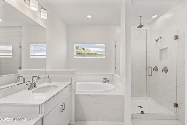 73 Ripple Rd, Saint Johns, FL 32095 - full bath with a garden tub, a marble finish shower, vanity, and recessed lighting