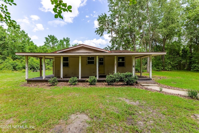 226 Six Pond Trl, Green Cove Springs, FL 32043 - farmhouse inspired home with covered porch, a front yard, and an attached carport