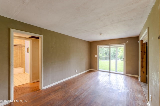 226 Six Pond Trl, Green Cove Springs, FL 32043 - spare room with hardwood / wood-style floors and a textured ceiling