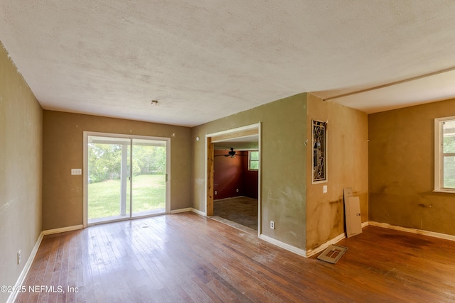 226 Six Pond Trl, Green Cove Springs, FL 32043 - unfurnished room with wood finished floors, healthy amount of natural light, and a textured ceiling