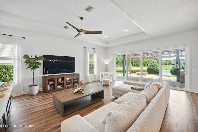 959 Crosswater Lake Dr, Ponte Vedra, FL 32081 - living area featuring a raised ceiling, a textured ceiling, ceiling fan, wood finished floors, and recessed lighting
