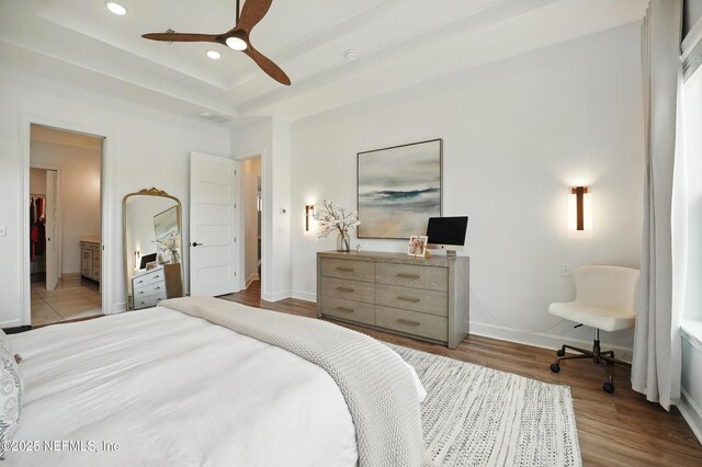 959 Crosswater Lake Dr, Ponte Vedra, FL 32081 - bedroom featuring wood finished floors, a raised ceiling, recessed lighting, ceiling fan, and ensuite bathroom