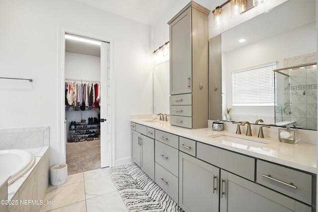 959 Crosswater Lake Dr, Ponte Vedra, FL 32081 - bathroom featuring a bath, a stall shower, double vanity, and a spacious closet