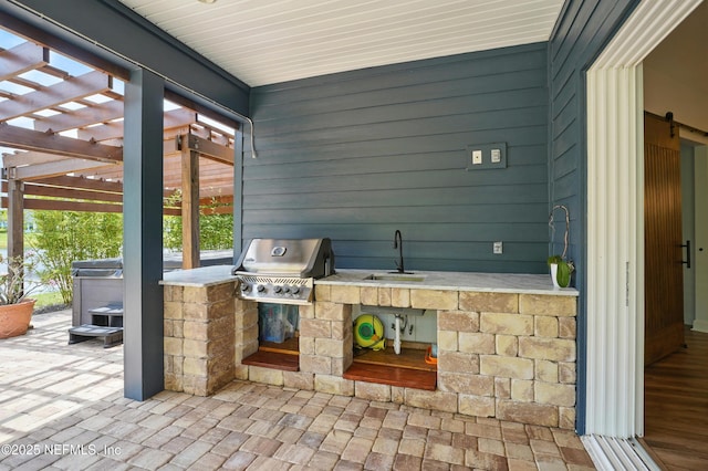 959 Crosswater Lake Dr, Ponte Vedra, FL 32081 - view of patio / terrace with an outdoor kitchen and a pergola