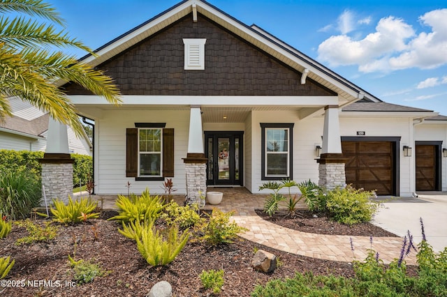959 Crosswater Lake Dr, Ponte Vedra, FL 32081 - craftsman house featuring covered porch, an attached garage, and concrete driveway