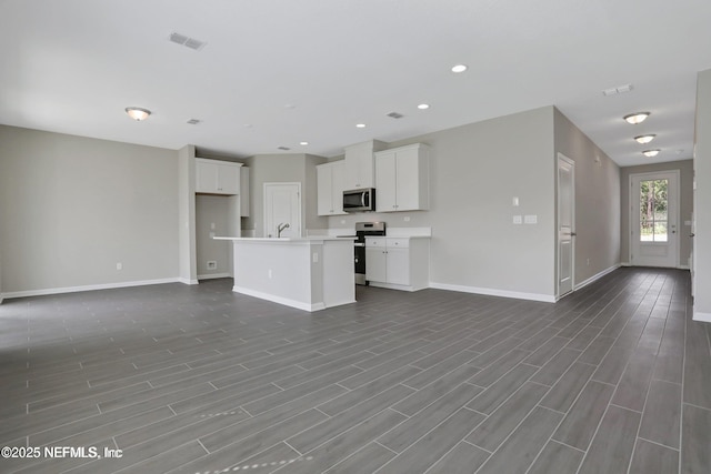 386 Whirlwind Pl, Saint Johns, FL 32095 - unfurnished living room featuring recessed lighting and dark wood finished floors